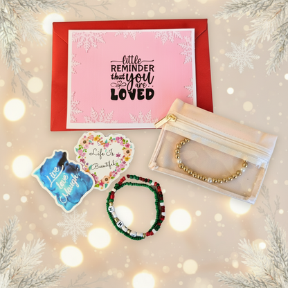 Set of bracelets, a card, and a pouch on a white background